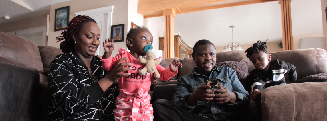 Family plays together in their home.