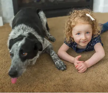 a kid and her dog