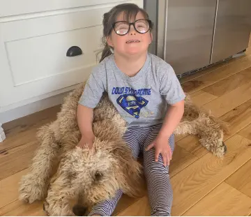 a kid and her dog